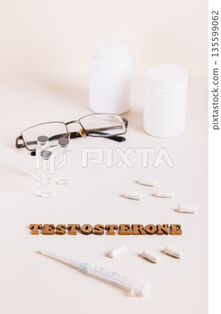Syringe, ampoules and capsules for regulating testosterone levels vertical view Syringe, ampoules and capsules for regulating testosterone levels vertical view 135599062