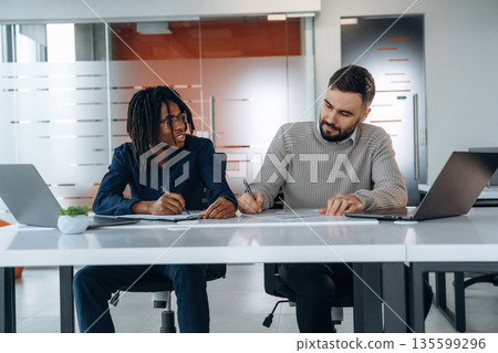 Modern office. Two men are working Modern office. Two men are working 135599296