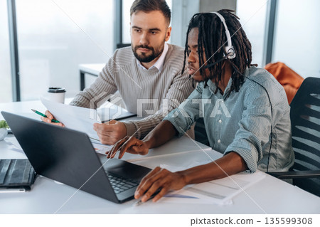 Modern office. Two men are working 135599308