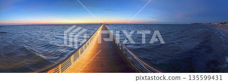 Symmetry on Groemitz pier at dusk 135599431