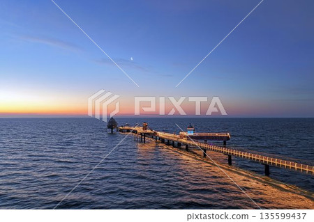 Drone picture along the Groemitz pier leading into the Baltic Sea 135599437