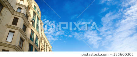 Classic European style apartment building facade with empty space banner Classic European style apartment building facade with empty space banner 135600305