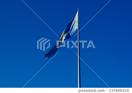 Flag of Kazakhstan against blue sky 135600328