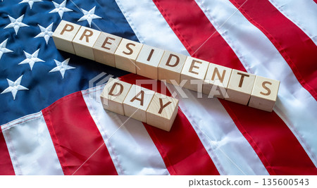 PRESIDENT'S DAY word made by wooden blocks over United States of America flag PRESIDENT'S DAY word made by wooden blocks over United States of America flag 135600543