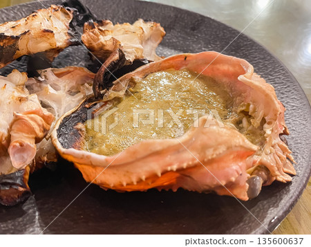 Grilled snow crab meat and crab miso. Close-up of the crab miso. Grilled snow crab meat and crab miso. Close-up of the crab miso. 135600637