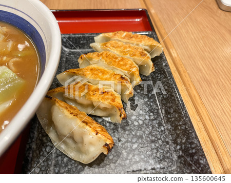 Fried dumplings eaten at a Japanese ramen restaurant. Fried dumplings eaten at a Japanese ramen restaurant. 135600645