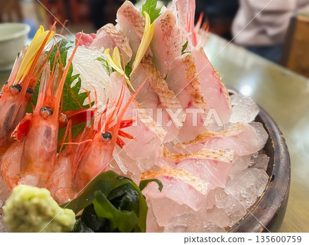 Assorted sashimi of sweet shrimp and blackthroat seaperch. Close-up of blackthroat seaperch. 135600759