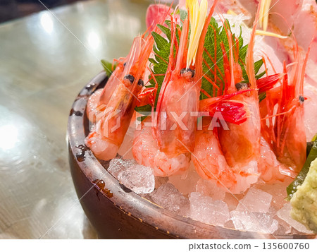 Assorted sashimi of sweet shrimp and blackthroat seaperch. Close-up of sweet shrimp. Assorted sashimi of sweet shrimp and blackthroat seaperch. Close-up of sweet shrimp. 135600760