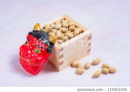 Red demon mask and Setsubun beans in a wooden box Red demon mask and Setsubun beans in a wooden box 135601048
