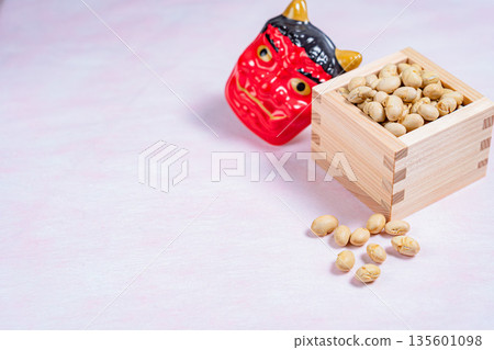 Red demon mask and Setsubun beans in a wooden box Red demon mask and Setsubun beans in a wooden box 135601098