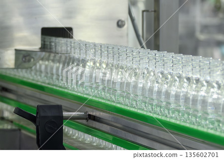 Drinking Water Production Process on Conveyor Belt in Bottling Plant Drinking Water Production Process on Conveyor Belt in Bottling Plant 135602701