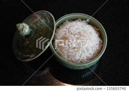 top view open the lid of the cup. The rice is in the ceramic cup. Placed on a marble table background, food, hot, object, copy space 135603740