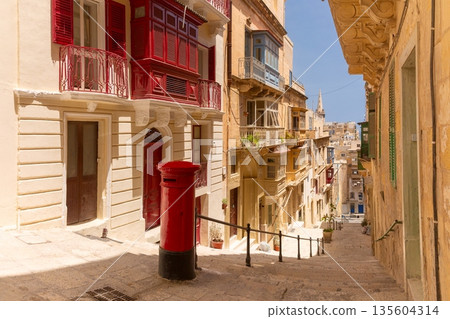 Colorful balconies on a narrow street in Valletta, Malta Colorful balconies on a narrow street in Valletta, Malta 135604314