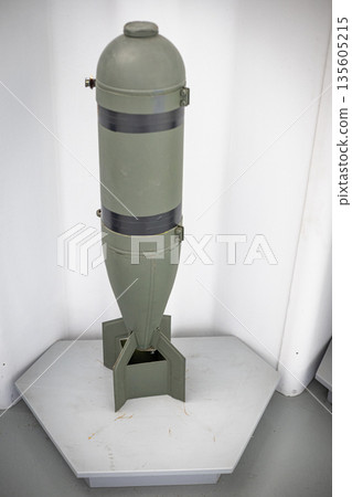 Military bomb standing on display representing destructive power 135605215