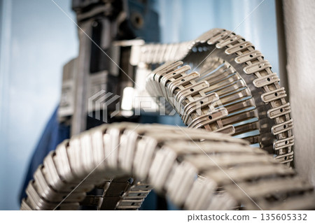 Metal manufacturing conveyor belt components moving through production Metal manufacturing conveyor belt components moving through production 135605332