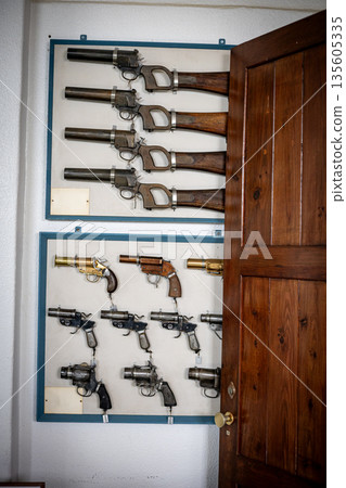 Vintage signal pistols and revolvers on museum display 135605335