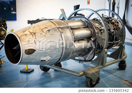 Vintage jet aircraft engine with exposed components in museum Vintage jet aircraft engine with exposed components in museum 135605342