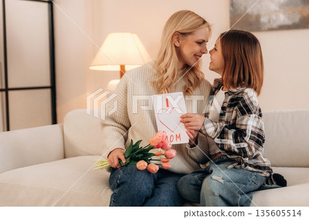 The mother's day gifts, celebration. Woman and her daughter are together The mother's day gifts, celebration. Woman and her daughter are together 135605514