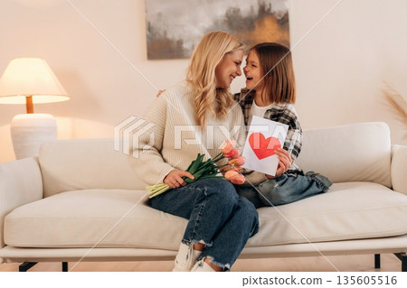 The mother's day gifts, celebration. Woman and her daughter are together The mother's day gifts, celebration. Woman and her daughter are together 135605516