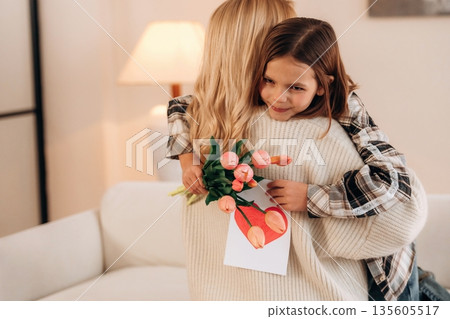 The mother's day gifts, celebration. Woman and her daughter are together The mother's day gifts, celebration. Woman and her daughter are together 135605517