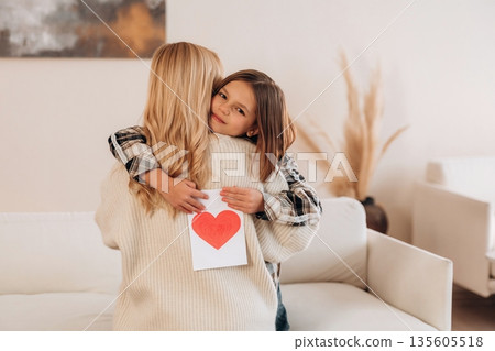 The mother's day gifts, celebration. Woman and her daughter are together The mother's day gifts, celebration. Woman and her daughter are together 135605518