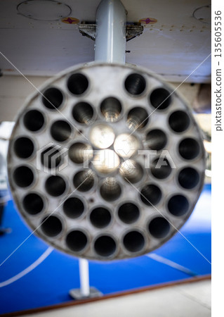 Military aircraft rocket launcher showing many openings Military aircraft rocket launcher showing many openings 135605536
