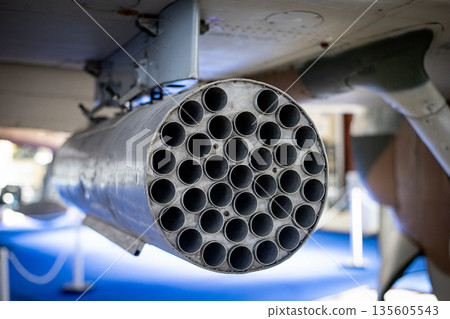 Military aircraft displaying multiple rocket launcher tubes 135605543
