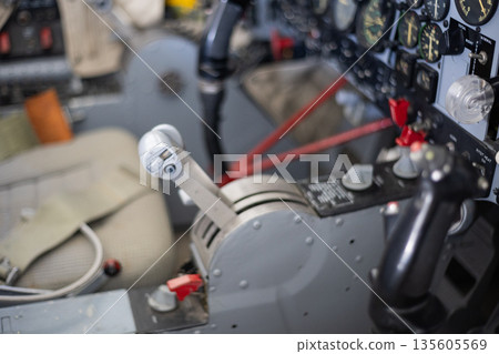 Airplane cockpit interior with throttle control and instrument panel Airplane cockpit interior with throttle control and instrument panel 135605569