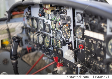 Aircraft cockpit panel displaying flight instruments and controls Aircraft cockpit panel displaying flight instruments and controls 135605571