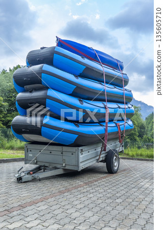 Stacking inflatable rafts and kayak on trailer for water sport Stacking inflatable rafts and kayak on trailer for water sport 135605710