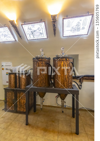 Traditional distilling equipment in a Cerveny Klastor monastery brewery Traditional distilling equipment in a Cerveny Klastor monastery brewery 135605769