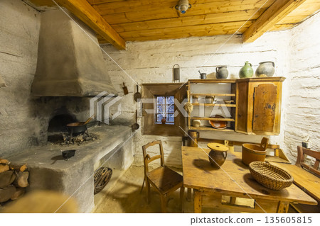 Traditional Slovak farmhouse kitchen interior with old stove Traditional Slovak farmhouse kitchen interior with old stove 135605815