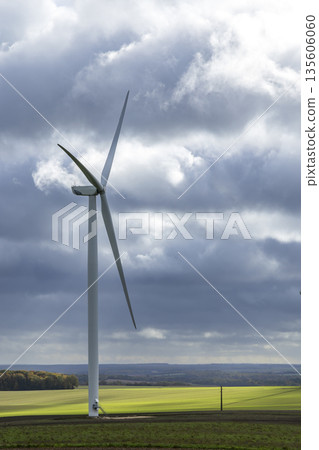 Wind turbine generating clean energy in rural France 135606060