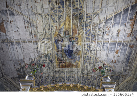 Decayed religious ceiling fresco with Madonna and angels 135606154
