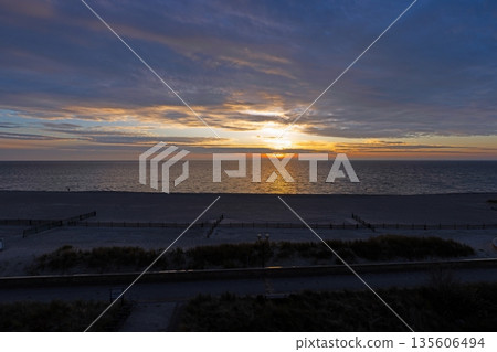 Sunrise over sandy beach in Groemitz at the Baltic Sea Sunrise over sandy beach in Groemitz at the Baltic Sea 135606494