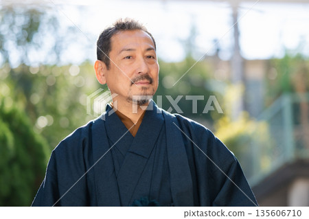 A man wearing a kimono A man wearing a kimono 135606710