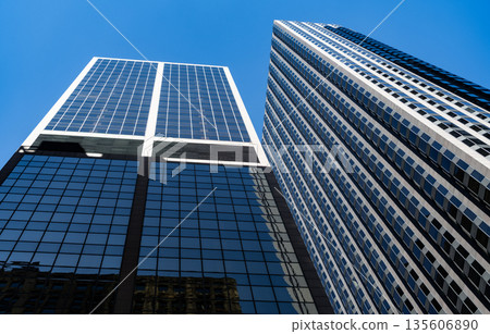 City architecture. Modern glass building. Reflective glass architecture. Architecture in business district. Building architecture. Business building. Glass building. Business city. Office center 135606890