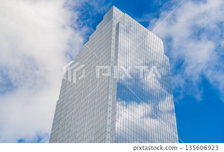 Architecture in business district. Building architecture. Business building. Glass building. Business city. City architecture. Modern glass building. Reflective glass architecture. Downtown hub Architecture in business district. Building architecture. Business building. Glass building. Business city. City architecture. Modern glass building. Reflective glass architecture. Downtown hub 135606923
