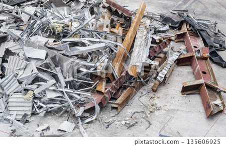 Aluminum scrap metal. Aluminum extrusion profile. Construction site storage with aluminum tubes. Steel extrusion. Industry material. Aluminum industry extrusion at building construction site 135606925