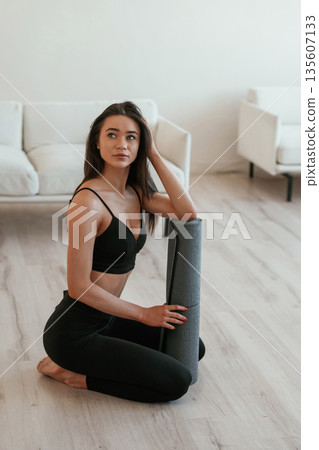 Young woman with slim body type is indoors Young woman with slim body type is indoors 135607133