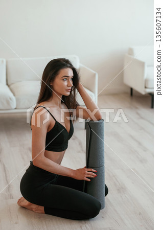 Young woman with slim body type is indoors Young woman with slim body type is indoors 135607134