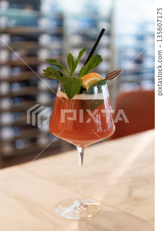 Glass of cocktail aperitif beverage. Summer drink. Cocktail in bar. Lemonade drink in glass. Cocktail drink. Aperitif in the bar. Summer refreshing cocktail. Drinking soft alcohol beverage Glass of cocktail aperitif beverage. Summer drink. Cocktail in bar. Lemonade drink in glass. Cocktail drink. Aperitif in the bar. Summer refreshing cocktail. Drinking soft alcohol beverage 135607175