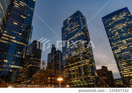 Chicago city with illuminated building. Night in Chicago city downtown. Skyscraper architecture. Chicago city cityscape. Cityscape night with skyscraper building. Glass buildings lit Chicago city with illuminated building. Night in Chicago city downtown. Skyscraper architecture. Chicago city cityscape. Cityscape night with skyscraper building. Glass buildings lit 135607182