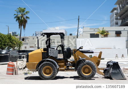 Compact wheel loader. Heavy equipment of compact wheel loader with hydraulic system. Wheel loader heavy machinery. Industrial heavy equipment. Compact wheel loader machinery Compact wheel loader. Heavy equipment of compact wheel loader with hydraulic system. Wheel loader heavy machinery. Industrial heavy equipment. Compact wheel loader machinery 135607189