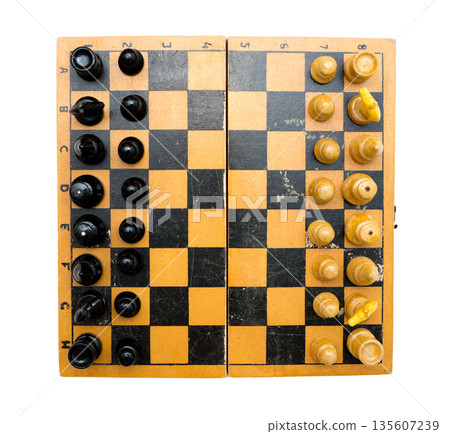 Vintage chess set with chessboard on white background. 135607239