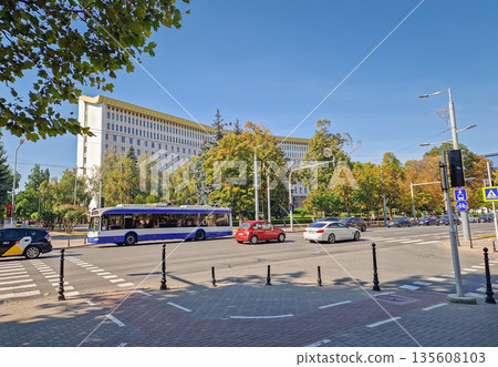 Chisinau, Moldova - September 24, 2025 Republic of Moldova parliament building with a view from the busy street traffic with cars and trolleybuses passing by 135608103