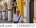 Senior woman at the historical Church of the Immaculate Conception built in 1843 in the beautiful Heritage Town of Mompox in Colombia 135608217