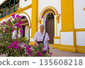 Senior woman at the historical Church of the Immaculate Conception built in 1843 in the beautiful Heritage Town of Mompox in Colombia 135608218