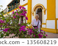 Senior woman at the historical Church of the Immaculate Conception built in 1843 in the beautiful Heritage Town of Mompox in Colombia 135608219