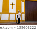 Senior woman at the historical Church of the Immaculate Conception built in 1843 in the beautiful Heritage Town of Mompox in Colombia 135608222